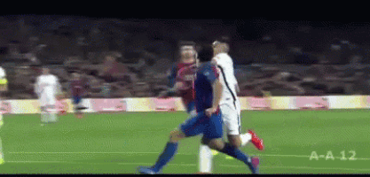 a soccer player is being tackled by another player on a field