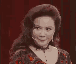 a black and white photo of a woman with a microphone on her head .