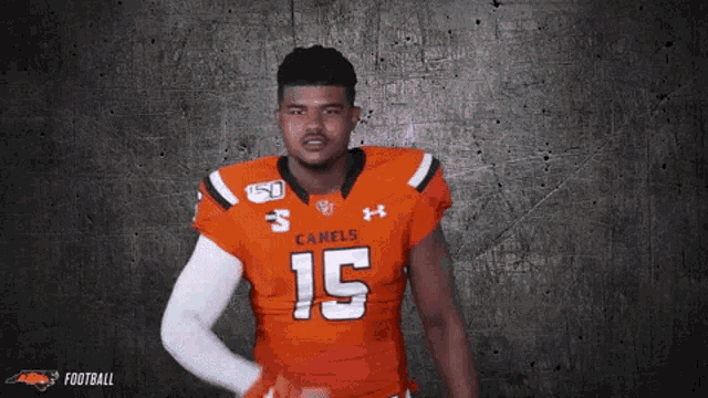 a football player wearing a jersey that says camels 15