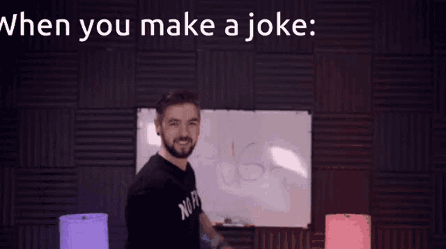 a man standing in front of a whiteboard that says laugh
