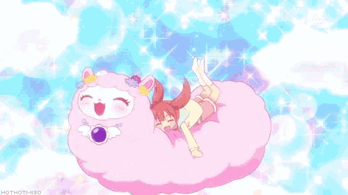 a girl is laying on top of a pink cloud