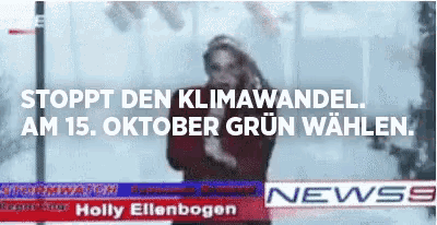 a blurred image of holly ellenbogen on a news screen