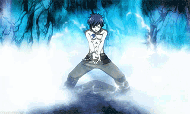 a man without a shirt is standing in a foggy forest