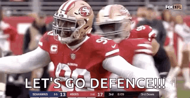 a football player with the word let 's go defence written on the screen .