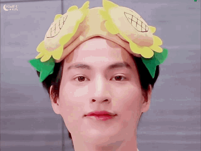 a close up of a person wearing a hat that looks like a hamburger
