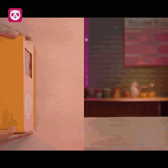 a pink and yellow box with a panda icon on it