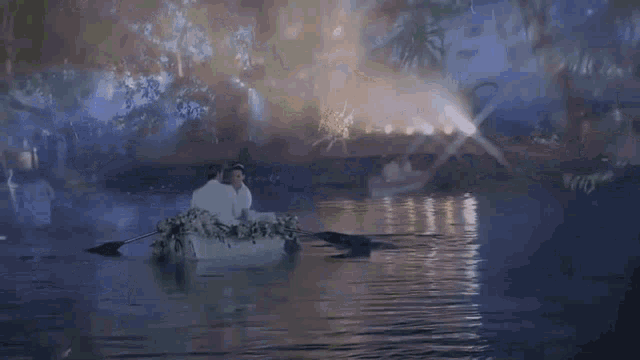 a boat with people in it is floating on a river .