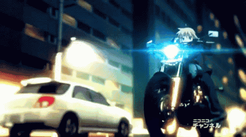 a person riding a motorcycle in front of a white car that says channel