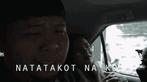a man and a woman in a car with the words natatakot nak on the bottom right