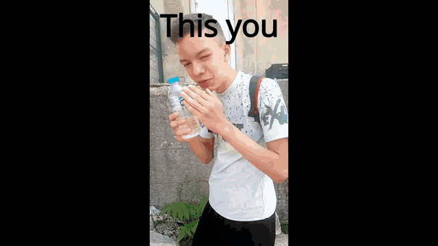 a boy with a backpack is holding a bottle of water and says " this you "