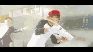 a man in a red hat is holding a piece of paper in his hand