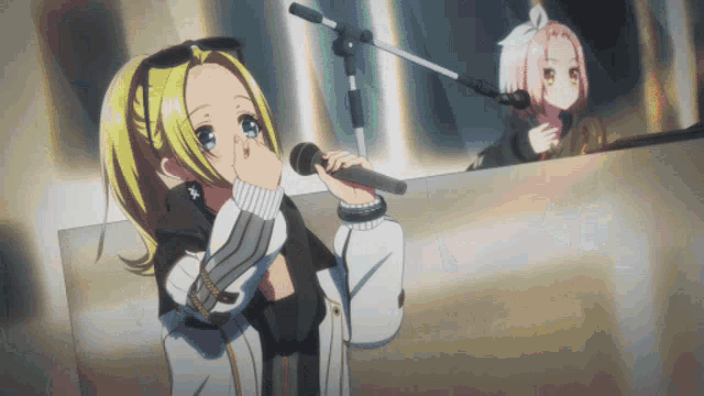 a girl is singing into a microphone while another girl plays a piano