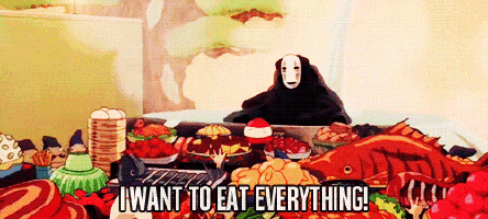 a cartoon character is sitting at a table with a bunch of food and says i want to eat everything !