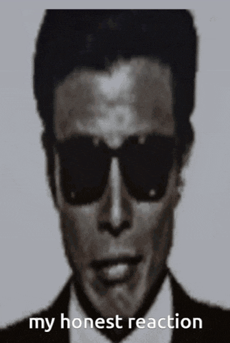 a black and white photo of a man wearing sunglasses with the words my honest reaction written below him
