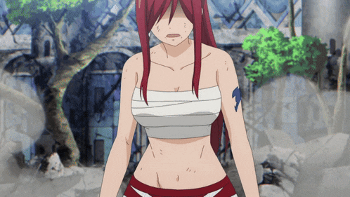 a girl with red hair is wearing a bandage around her chest