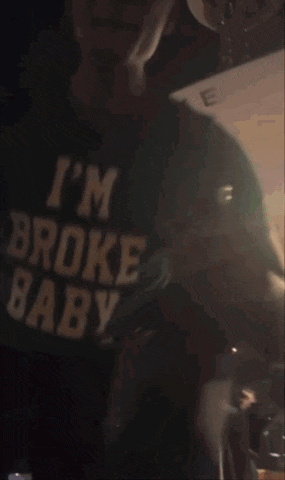 a blurry picture of a person wearing a green shirt that says bae on it .