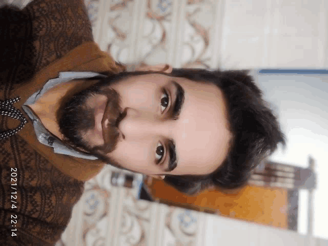 a man 's face is shown with a date of 2021