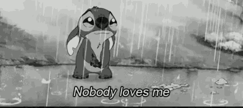 a black and white photo of a cartoon character standing in the rain with the words `` nobody loves me '' .