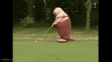 a clown is playing golf on a green field