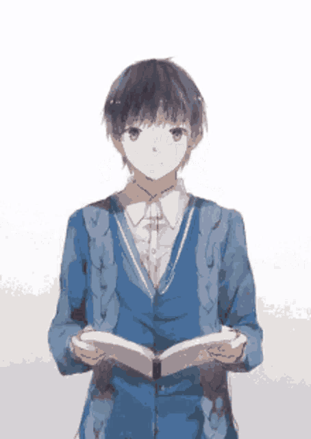 a boy in a blue jacket is holding a book