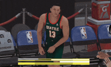 seattle basketball player michael flecha jr. sits in the stands during a game