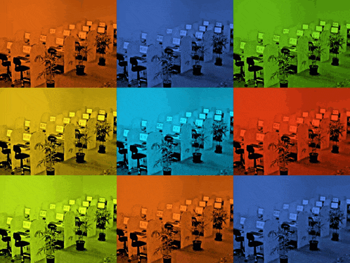 a row of computer cubicles with one that says ' a ' on the top