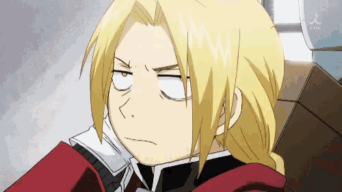 a close up of a person making a funny face with their eyes closed