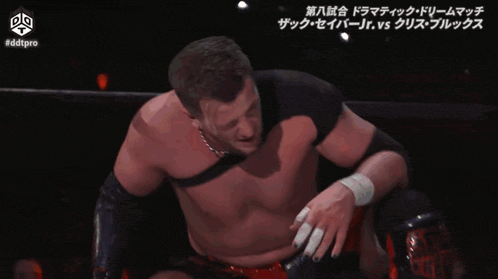 a wrestling match is being shown on a screen with #ddtpro