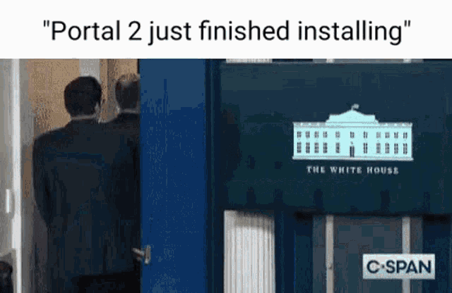 a man in a suit is standing in front of a blue door with a white house on it .