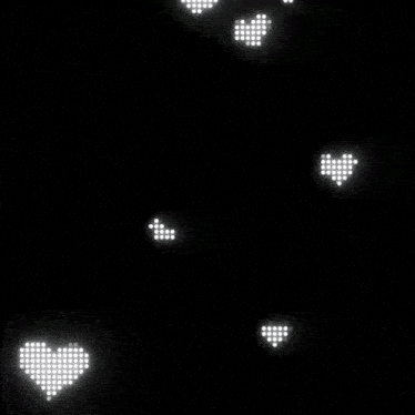 a black background with white hearts and dots on it