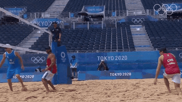 a beach volleyball game is being played in tokyo 2020