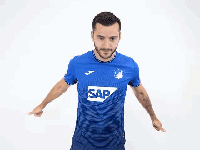 a man is wearing a blue shirt with the word sap on it