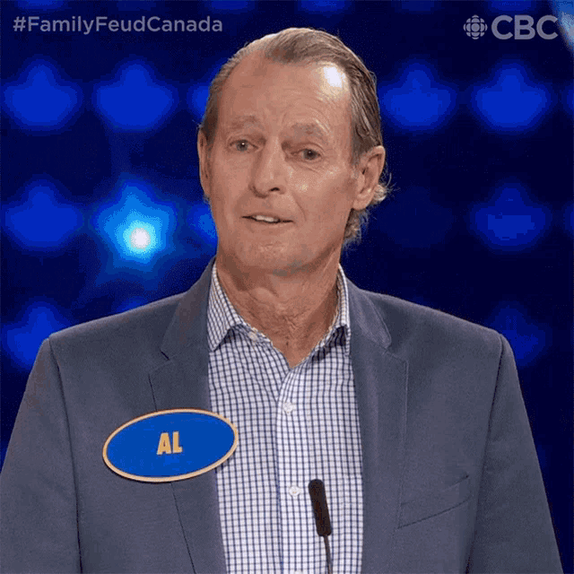 a man in a suit and name tag that says al