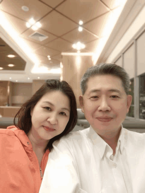 a man and a woman posing for a picture together
