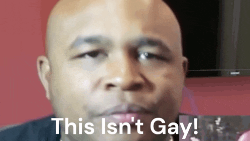 a close up of a man 's face with the words " this isn 't gay " on the bottom