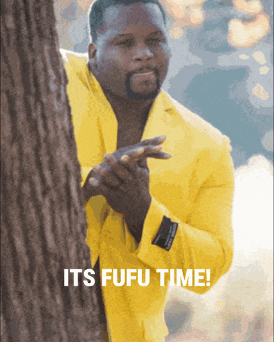 a man in a yellow suit is peeking out from behind a tree and says " it 's fufu time "
