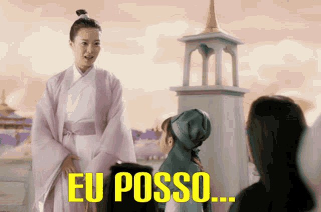 a woman in a pink robe stands in front of a tower with eu posso written in yellow