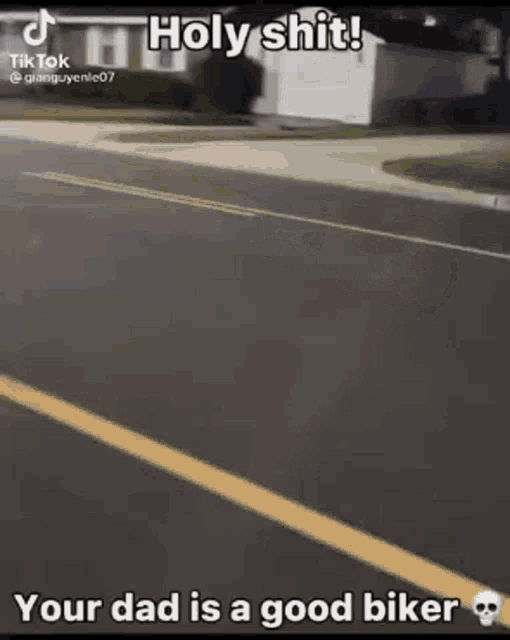 a man is riding a motorcycle down a street and says `` holy shit ! ''
