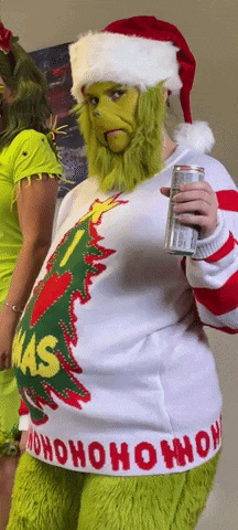 a person dressed as the grinch holding a can of beer
