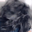 a close up of a person 's head with a blurred background