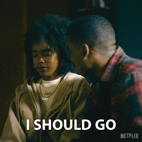 a man and a woman are looking at each other and the woman says i should go netflix