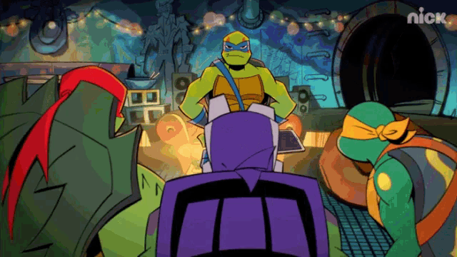 a group of teenage mutant ninja turtles are standing in front of a nickelodeon logo