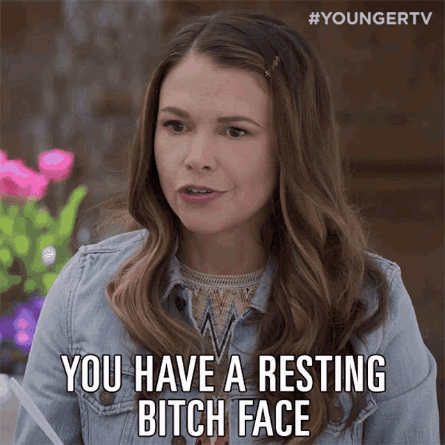 a woman says " you have a resting bitch face " while wearing a denim jacket