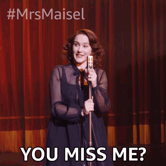 a woman singing into a microphone with a caption that says you miss me