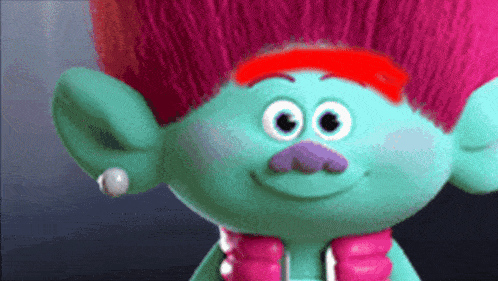 a troll with red hair and a mustache is wearing a pink scarf