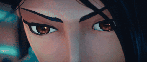 a close up of a woman 's eyes with a dark background