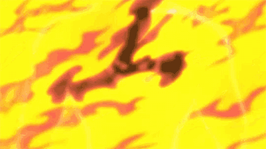 a close up of a person surrounded by flames in a fire .