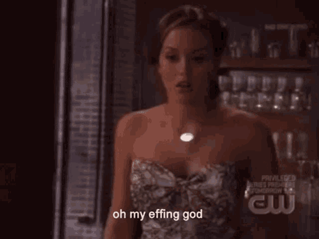 a woman in a strapless dress is saying oh my effing god