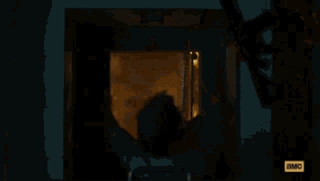a dark room with a lot of lights and a blurred image of a person walking through it .