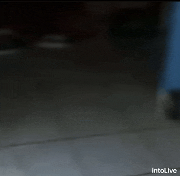 a blurred image of a dark room with intolive written on the bottom